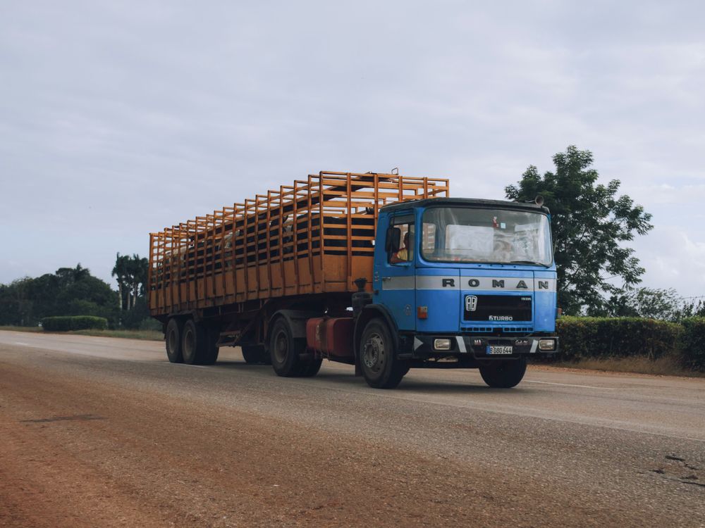 Blue truck on asphalt road